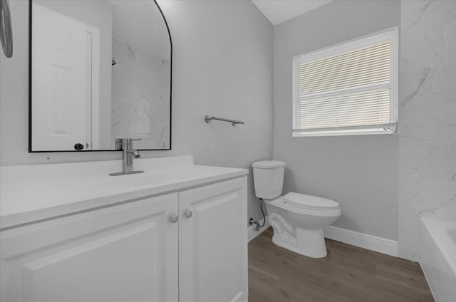 full bathroom with toilet, shower / bath combination, hardwood / wood-style floors, and vanity