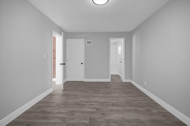 empty room featuring dark hardwood / wood-style floors