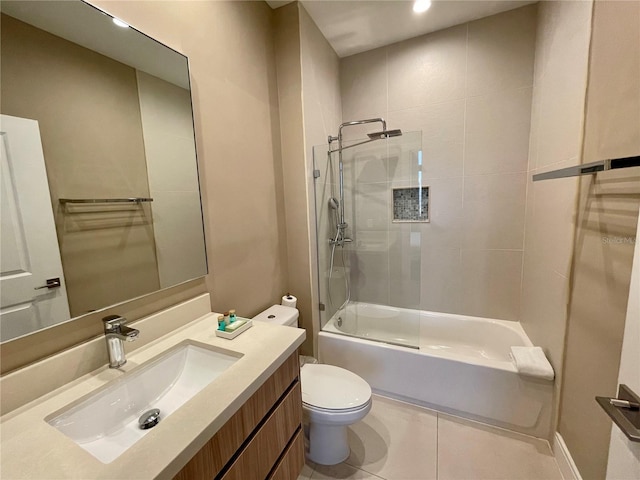 full bathroom featuring vanity, toilet, shower / bath combination with glass door, and tile patterned flooring