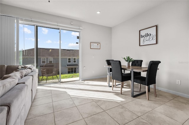 dining space featuring light tile patterned floors