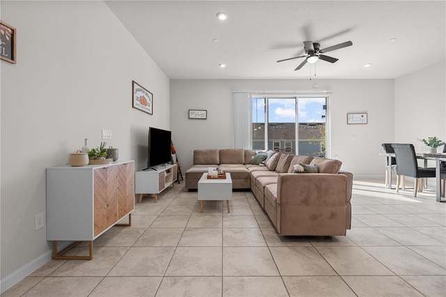 living room featuring light tile patterned flooring and ceiling fan