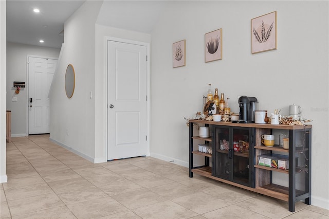 hallway featuring light tile patterned floors