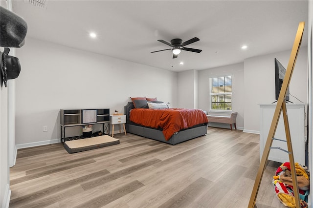 bedroom featuring light hardwood / wood-style floors and ceiling fan