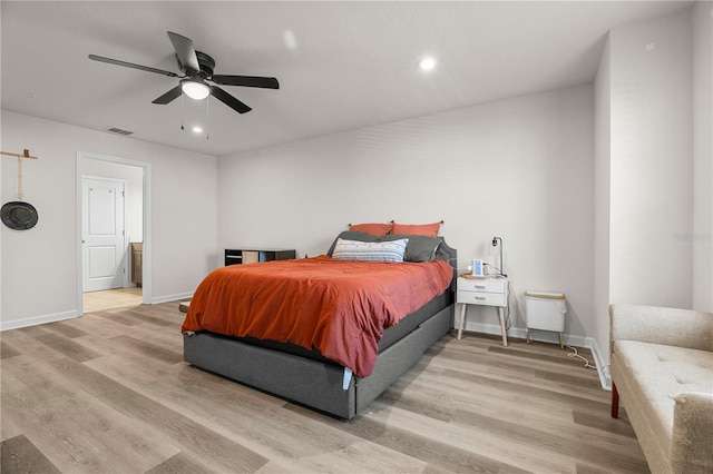 bedroom featuring light hardwood / wood-style flooring and ceiling fan