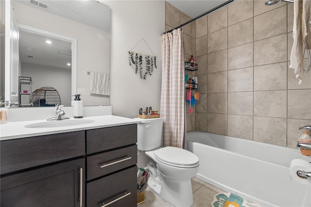 full bathroom with vanity, shower / bath combo, toilet, and tile patterned floors