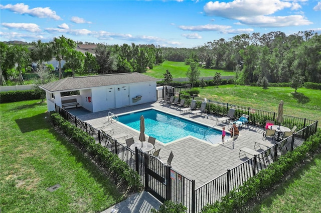 view of pool featuring a patio area and a lawn