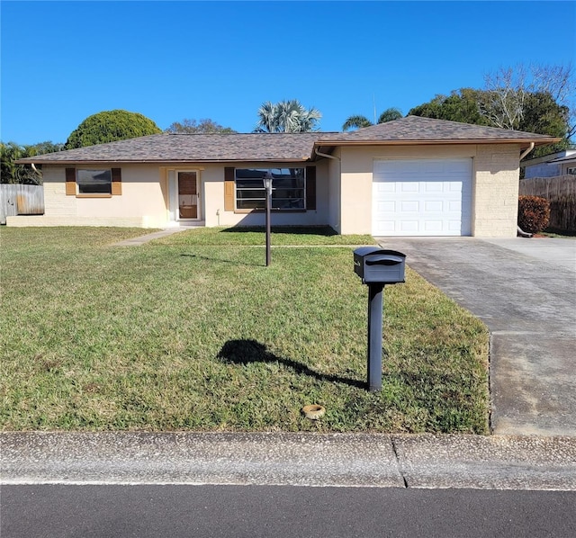 single story home with a garage and a front yard