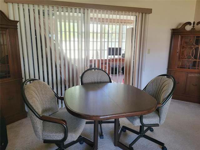 view of carpeted dining space