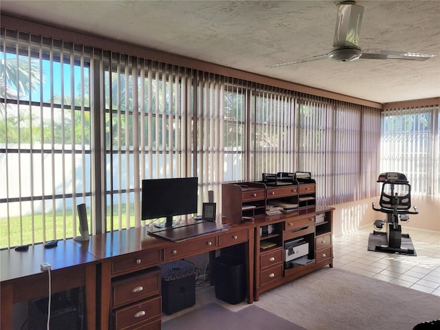 office area with ceiling fan, light colored carpet, and a textured ceiling