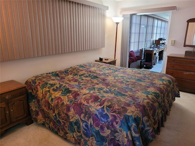 bedroom with light colored carpet