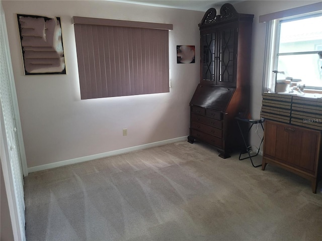 bedroom featuring light colored carpet