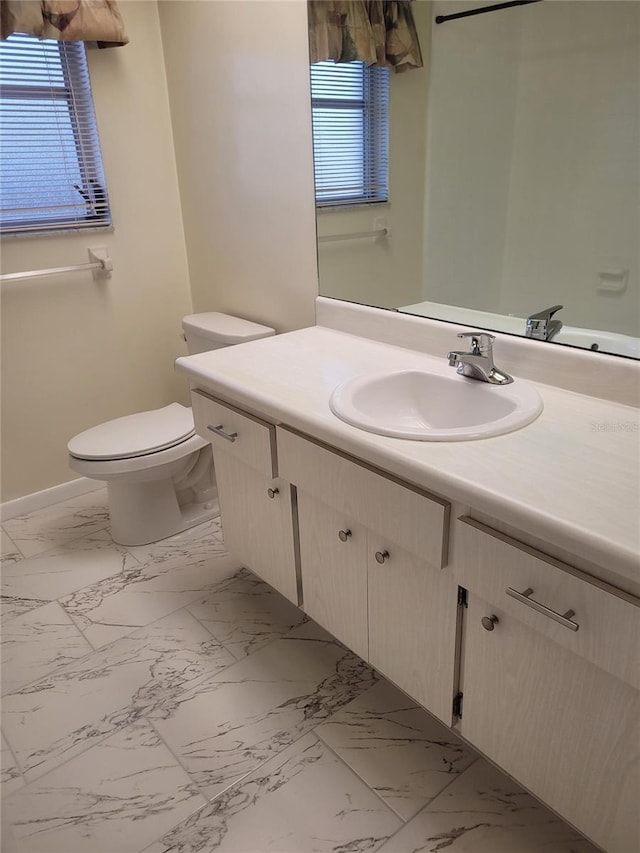 bathroom with vanity and toilet