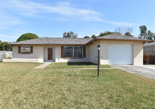 ranch-style house featuring a garage and a front yard