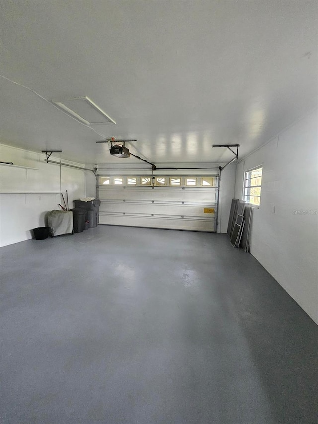 garage featuring a garage door opener