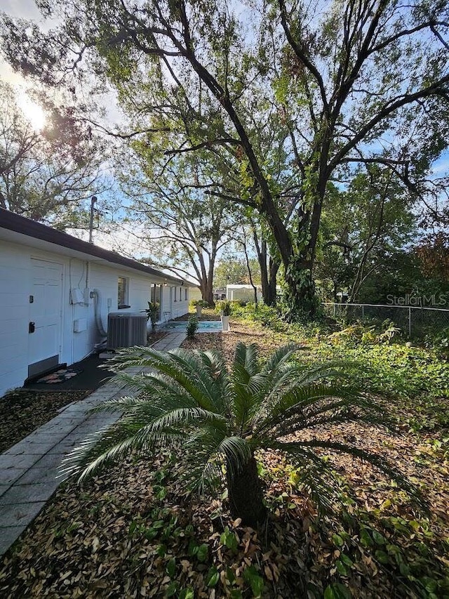 view of yard with central AC