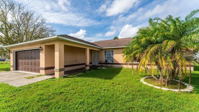 view of side of property featuring a garage and a lawn