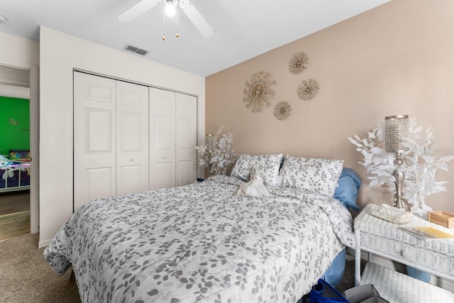 bedroom with carpet floors, ceiling fan, and a closet