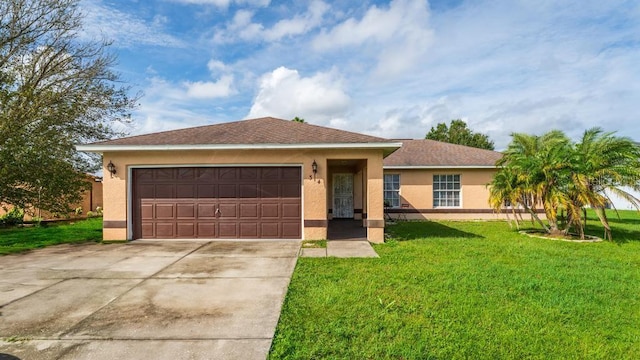 ranch-style house featuring a front lawn and a garage