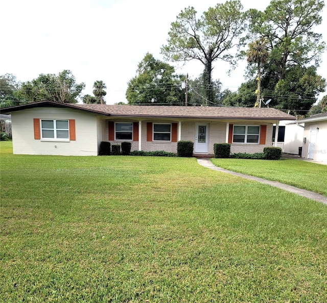 single story home with a front yard