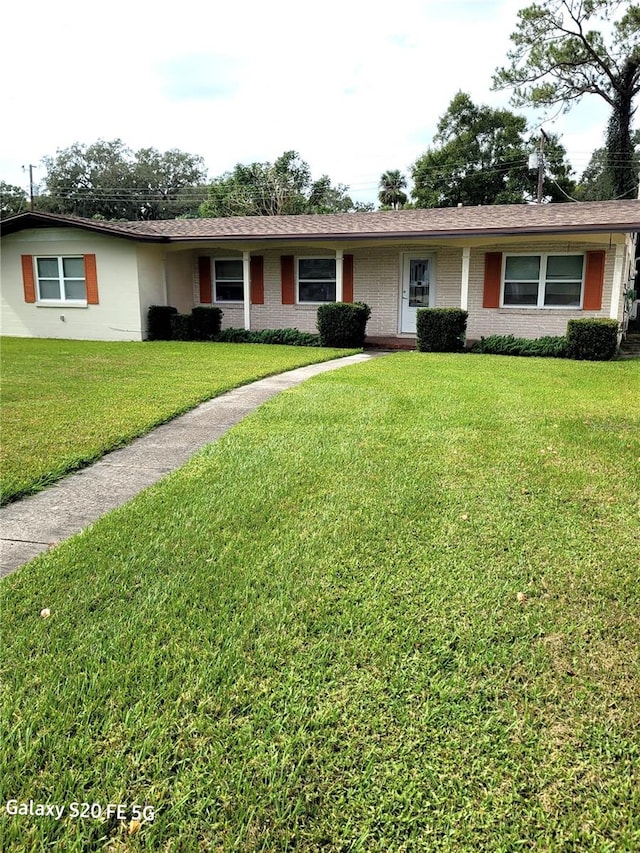 ranch-style house with a front lawn