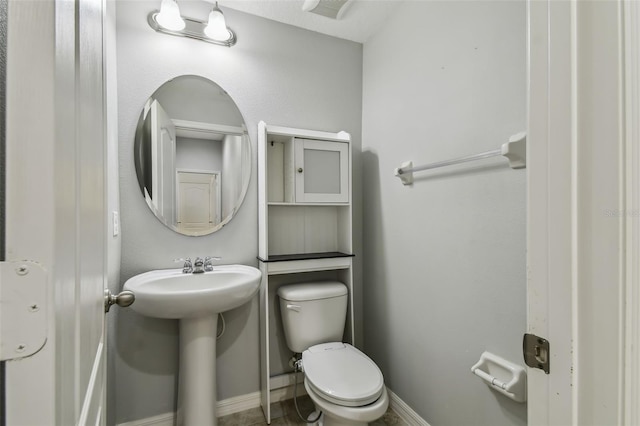 bathroom featuring toilet