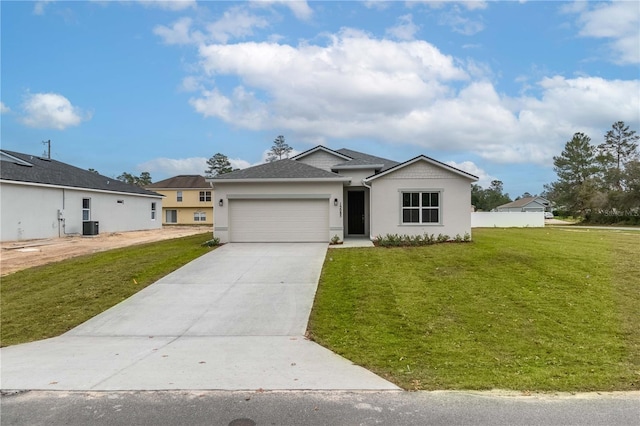 single story home featuring a front yard, central AC unit, and a garage