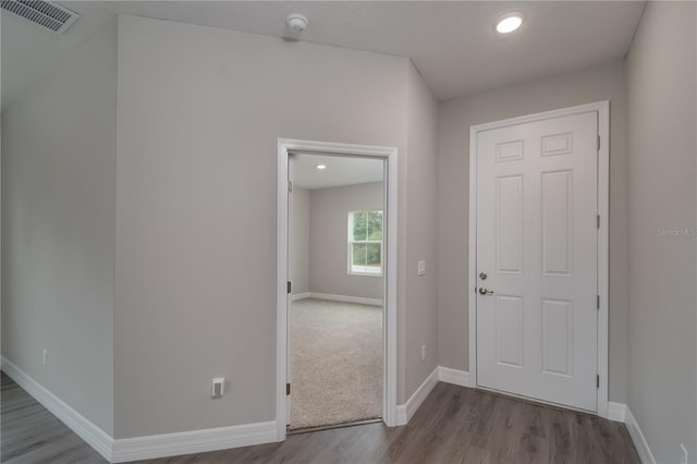 corridor featuring light hardwood / wood-style floors