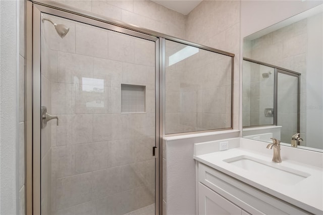 bathroom featuring vanity and walk in shower