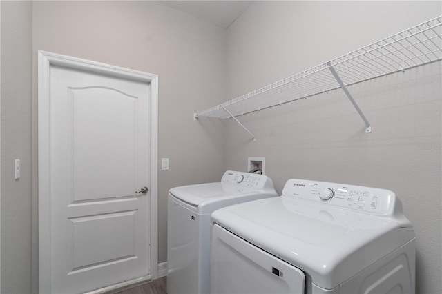 laundry room with separate washer and dryer