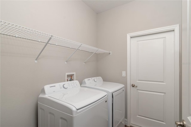 laundry room featuring laundry area and washing machine and clothes dryer