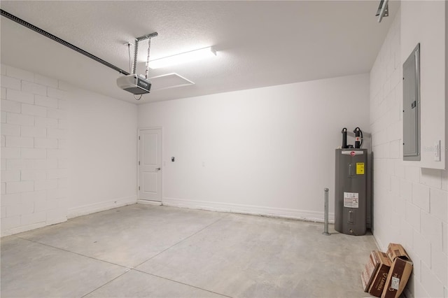 garage with a garage door opener, concrete block wall, electric panel, and water heater