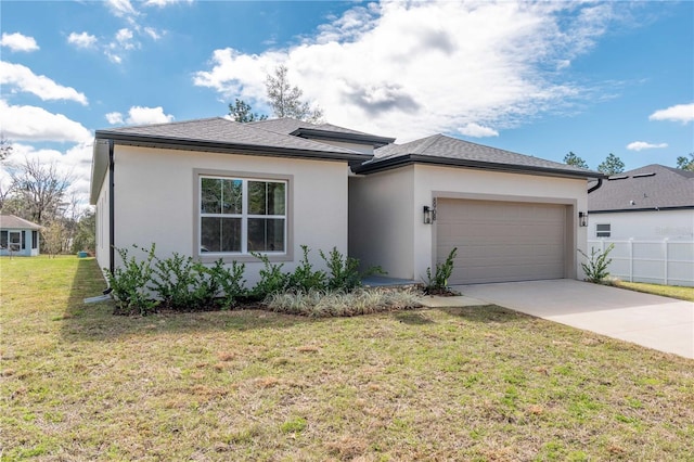 view of front of home featuring a garage, concrete driveway, a front lawn, and stucco siding