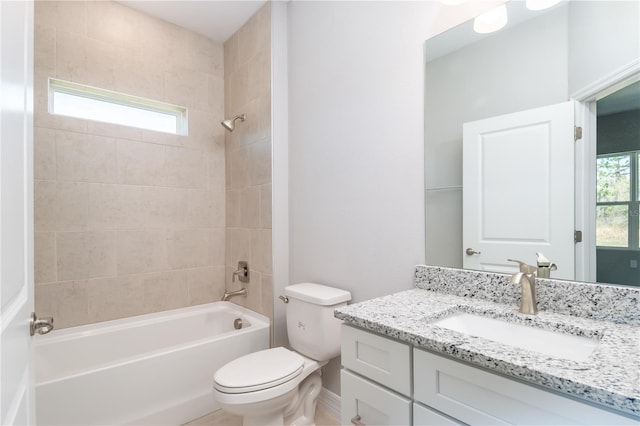 bathroom with toilet, vanity, a wealth of natural light, and shower / bathing tub combination