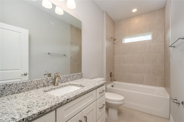 full bath with shower / bathing tub combination, vanity, toilet, and tile patterned floors