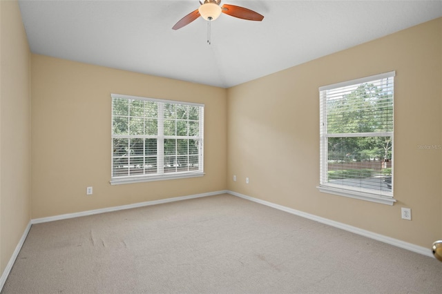 carpeted empty room with ceiling fan