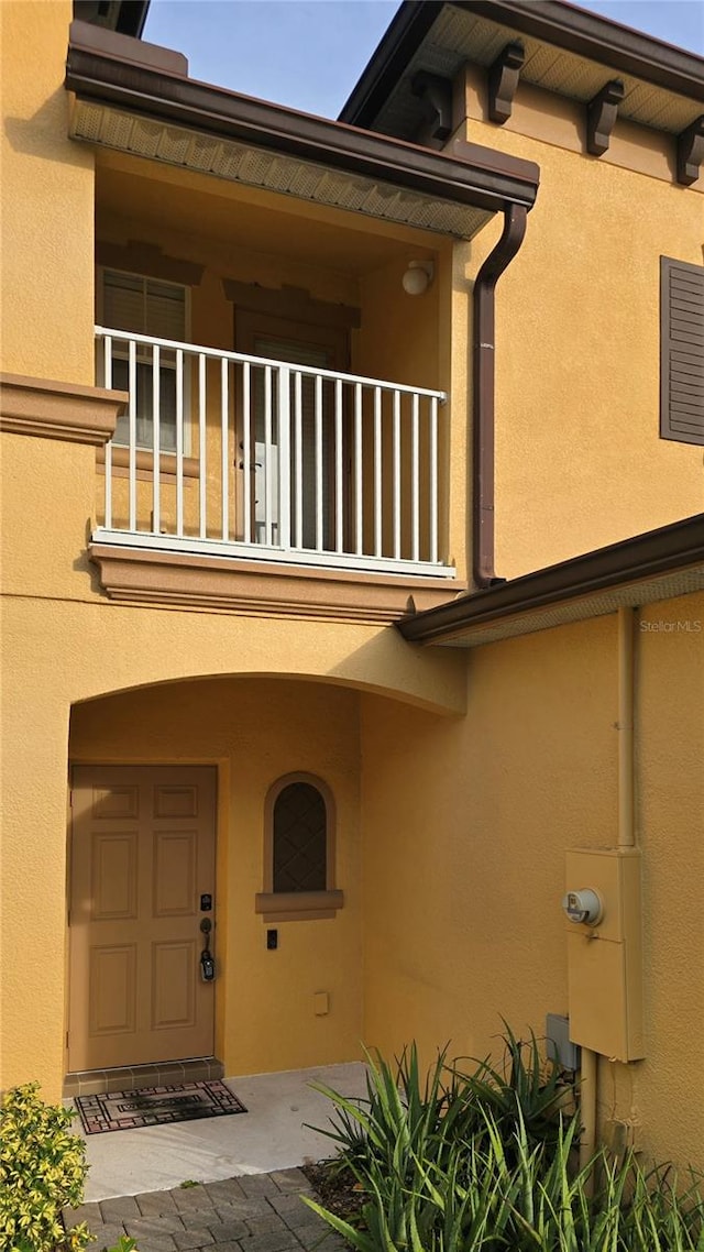 doorway to property featuring a balcony