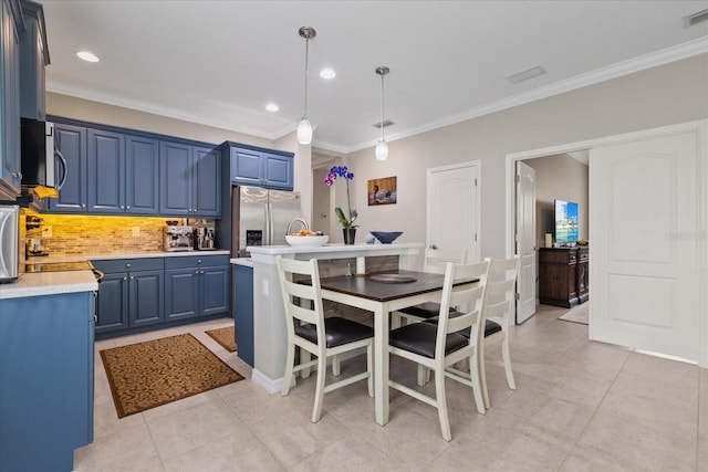 kitchen with blue cabinets, stainless steel fridge, decorative light fixtures, decorative backsplash, and light tile patterned floors