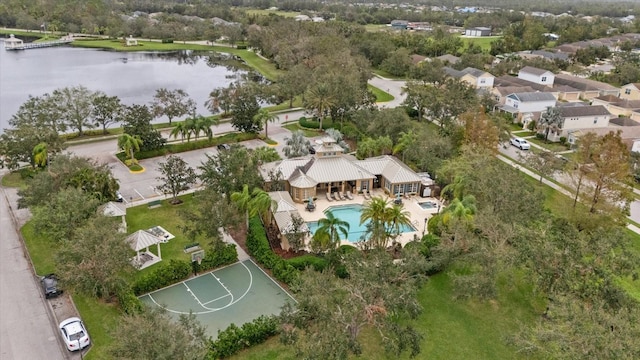 birds eye view of property with a water view