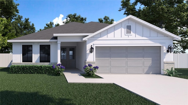 view of front of house with a garage and a front lawn