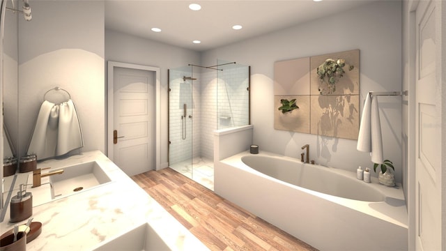 bathroom with hardwood / wood-style floors, vanity, and plus walk in shower