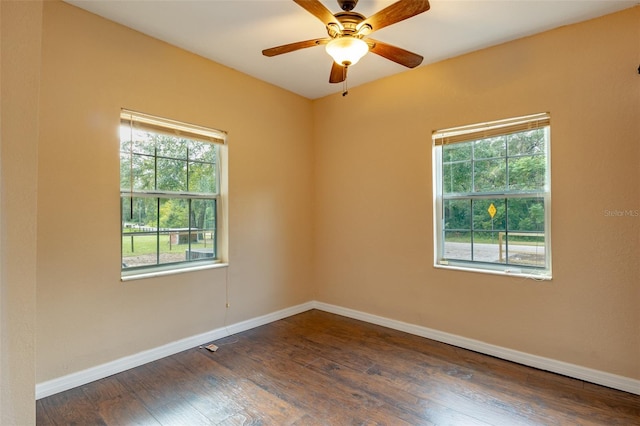 unfurnished room featuring ceiling fan and dark hardwood / wood-style floors