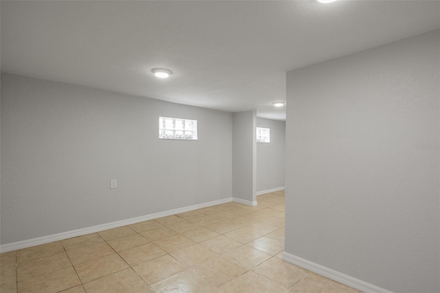 basement featuring light tile patterned floors