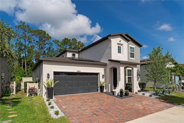 view of front of house with a front lawn and a garage