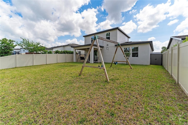 back of property with a lawn