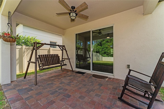 view of patio featuring ceiling fan