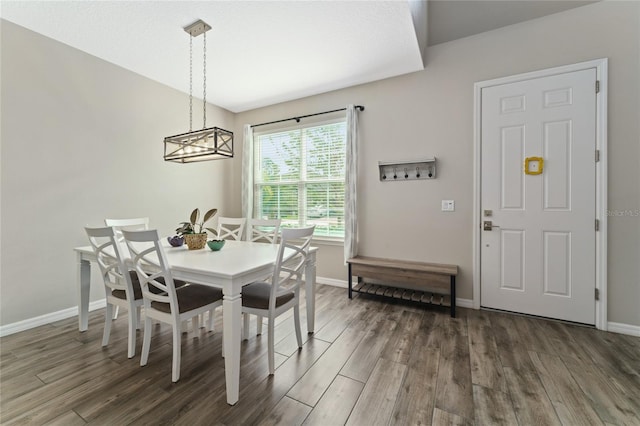 dining room featuring a chandelier and dark hardwood / wood-style flooring