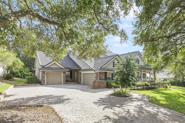 view of front of home with a garage and a front yard