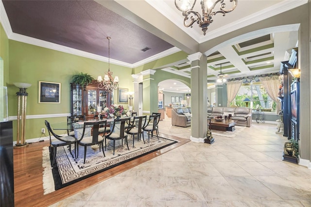 dining space featuring coffered ceiling, ceiling fan with notable chandelier, ornamental molding, beam ceiling, and decorative columns