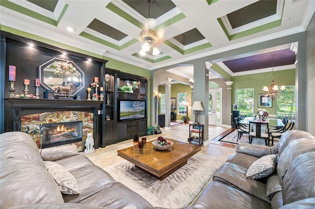 living room featuring ornate columns, ornamental molding, and coffered ceiling