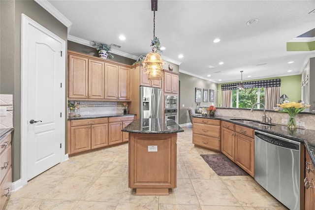 kitchen with pendant lighting, a center island, stainless steel appliances, and sink